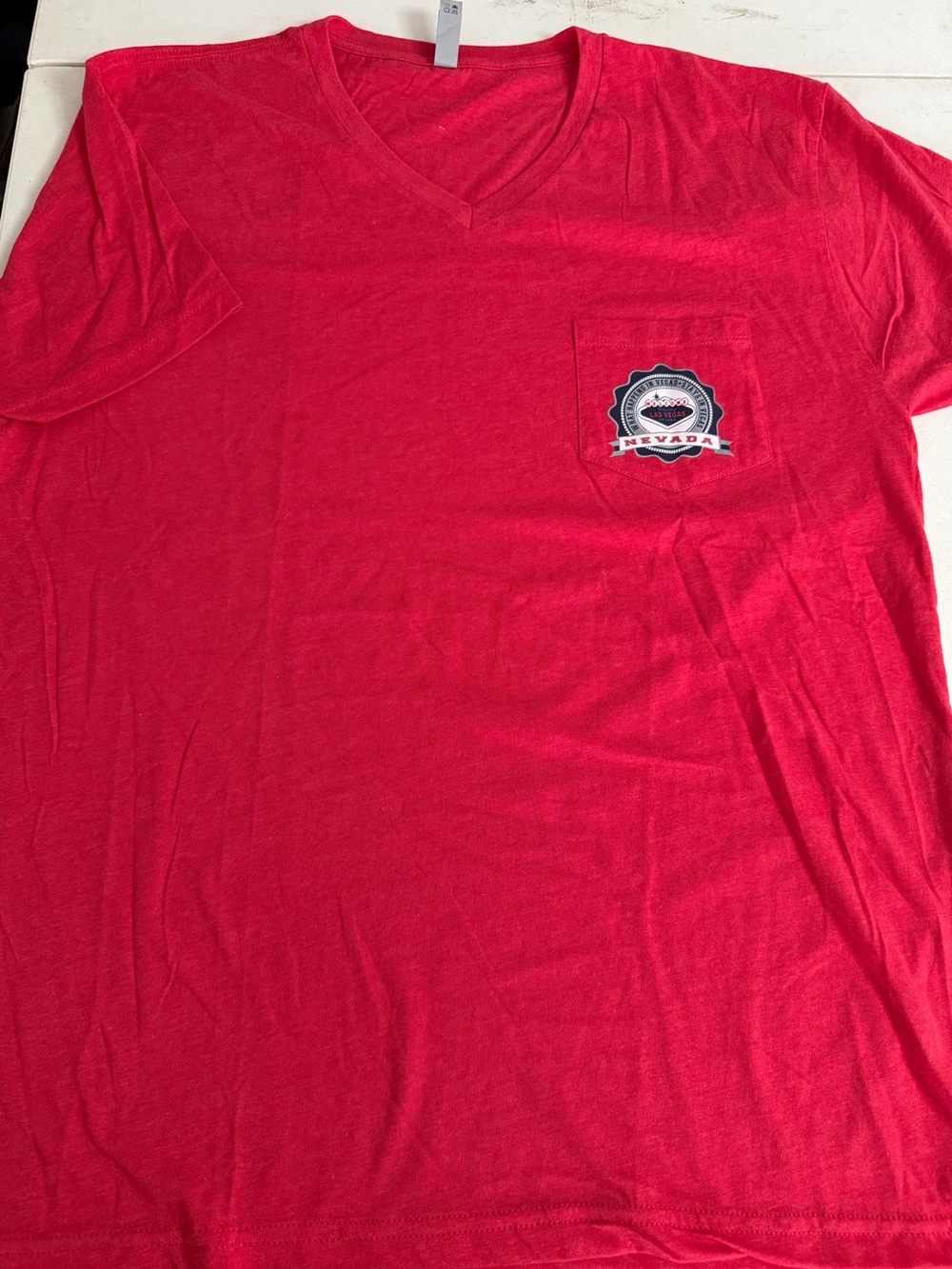 Next Level Apparel Red V‑Neck Pocket T‑Shirt with Nevada Patch